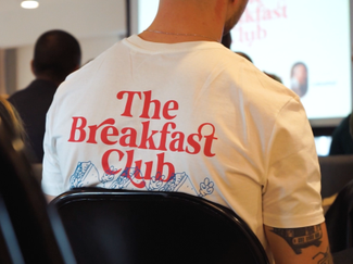Attendees of an event listening to a speaker