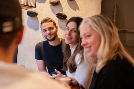 Thriving on the strength of connection and soft skills: three young individuals enjoying shared happiness.