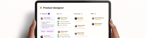 Hands holding a tablet displaying a product designer recruitment dashboard with candidate statuses: Suggested, Inbox, Interviewing, and Hired.